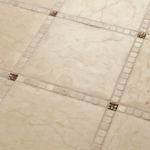 Foundry Art Lotus 1-inch metal accent inset tiles cream marble floor installation
