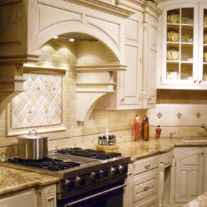 Traditional Bronze tile accent white French kitchen
