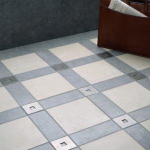 Foundry Art Square metal accent inset tile blue and gray limestone floor installation