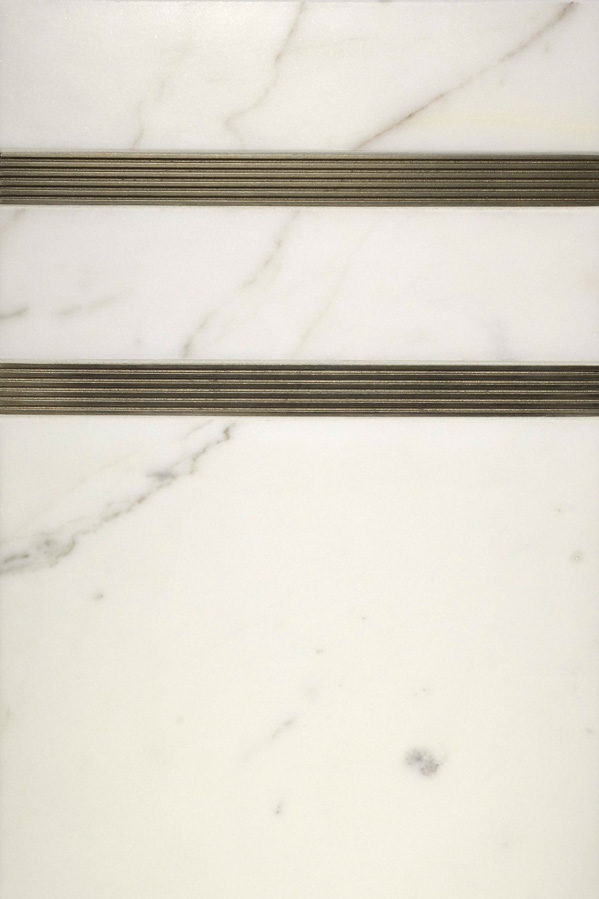 Bronzework Studio Autograph Tuxedo graphic metal accent liner tile with white marble display
