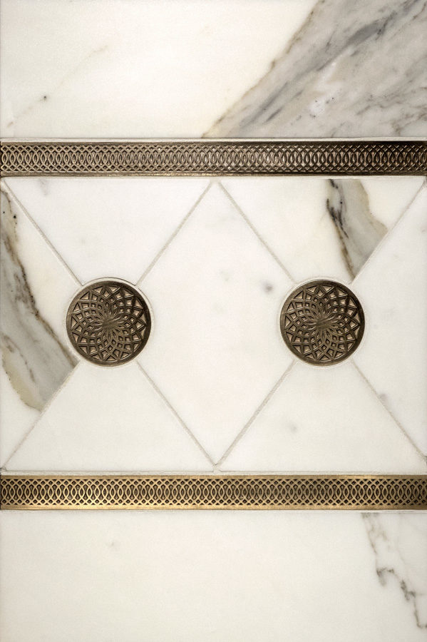 Bronzework Studio Autograph Dahlia inset and Octave graphic metal accent liner tile with white marble display