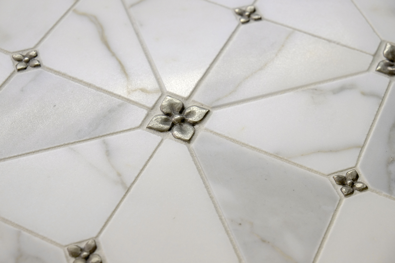 Metal accent tiles: Blooming Leaf in White Bronze in two sizes with Calacatta Marble